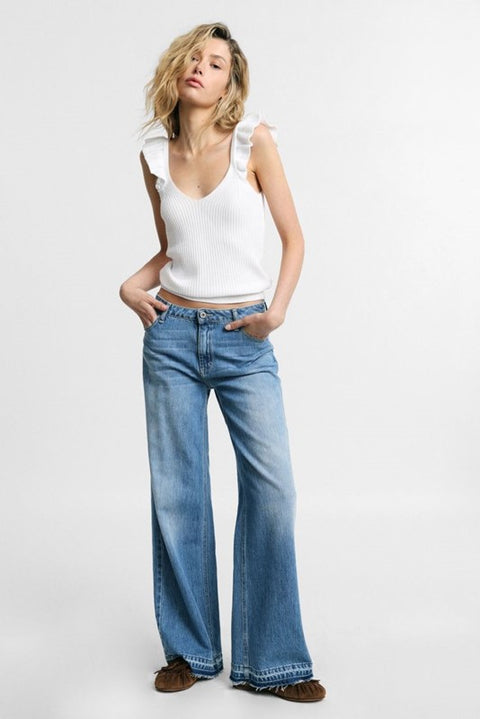 Jeans flare con vita bassa e fondo sfrangiato